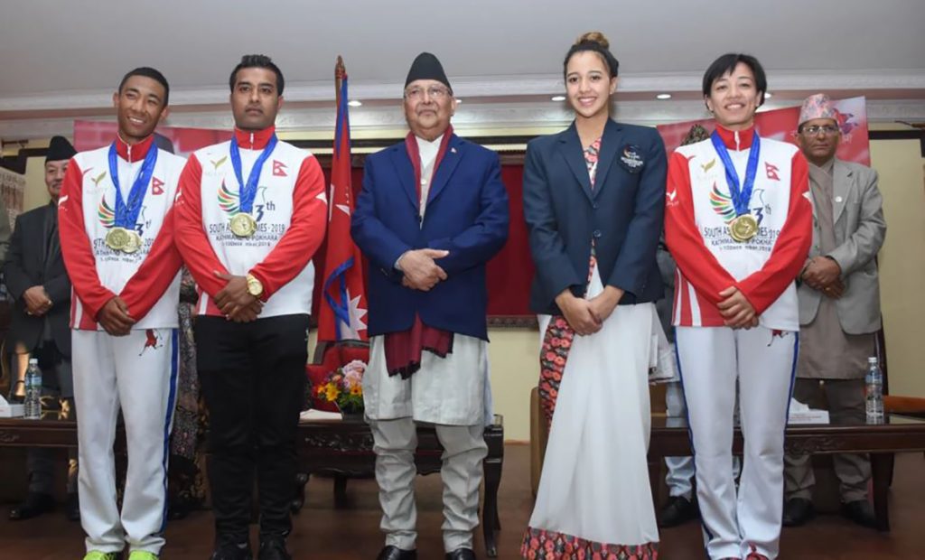 Kp Oli with Gold Medalist