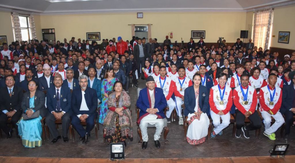 Kp Oli with Gold Medalist